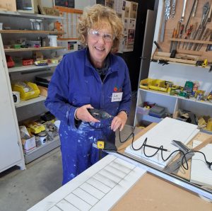 Sue making scoring boards for the petanque club